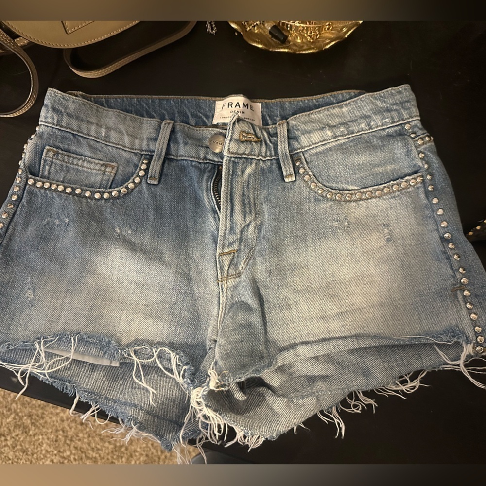 FRAME Denim studded shorts with frayed hem Western style distressed light wash